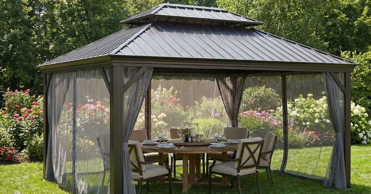 Backyard discovery gazebo with a metal roof and mosquito netting for shaded outdoor dining.